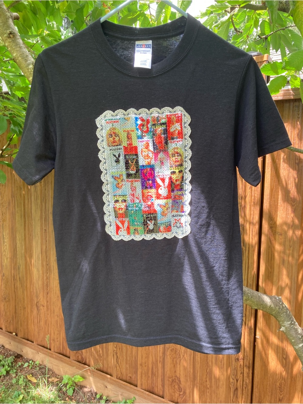 Black Graphic Tee with Colorful Patch Design